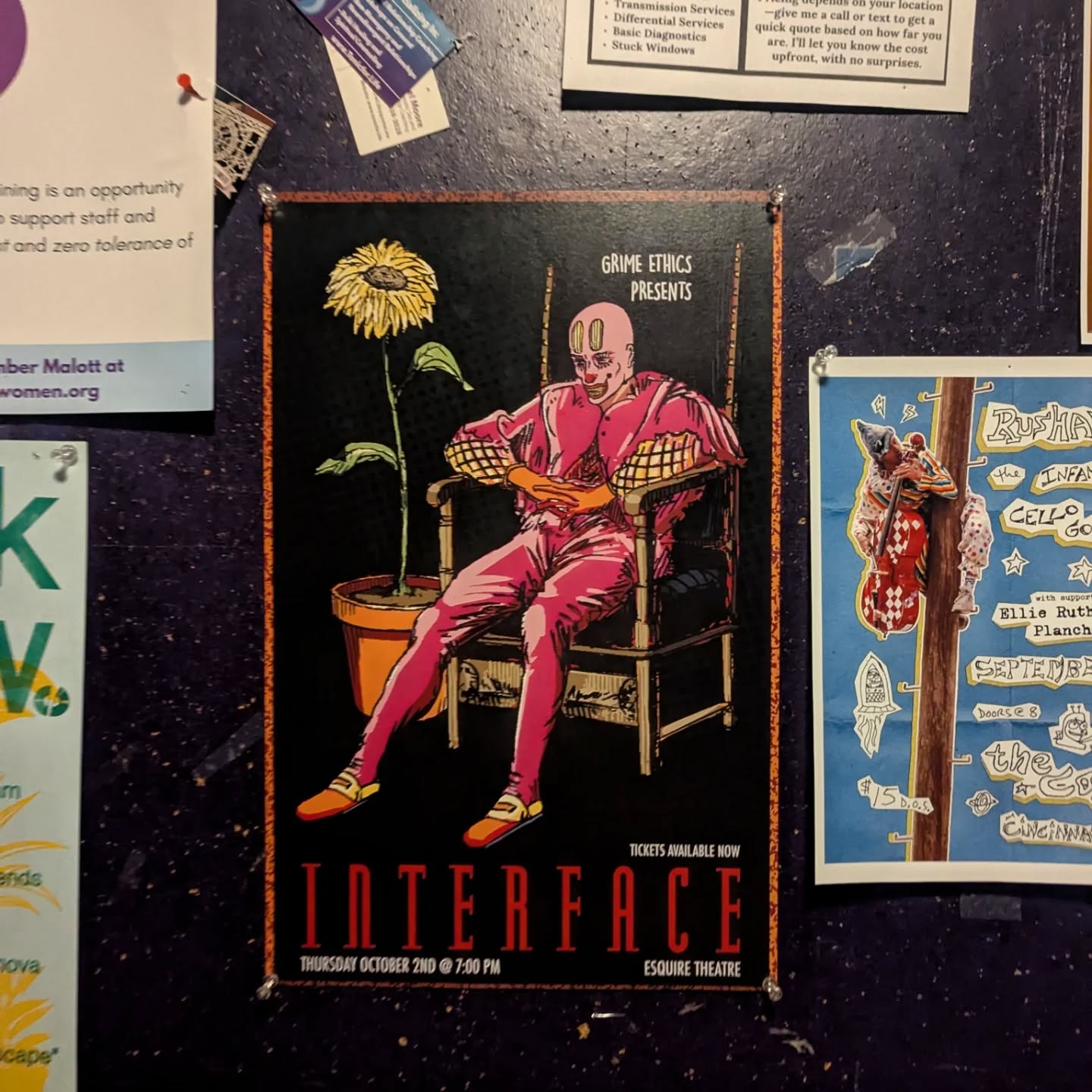 The Interface poster on a corkboard among other flyers